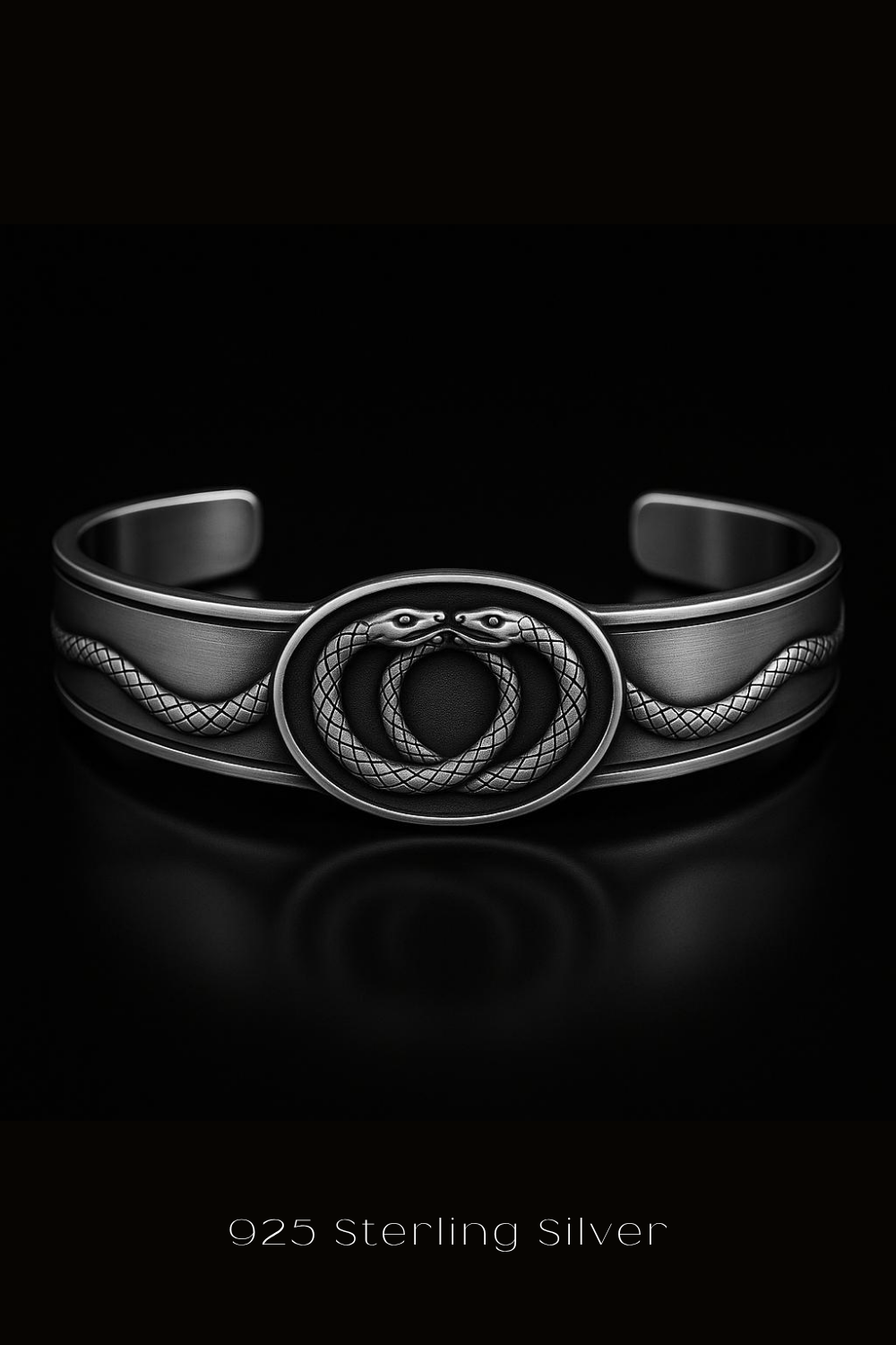 A silver bracelet with a snake design on the front, set against a black background.