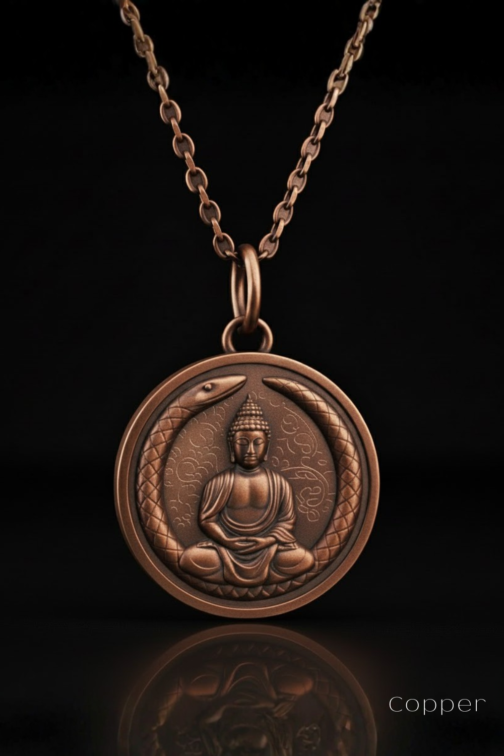 A copper-colored pendant necklace with a circular medallion featuring a seated Buddha figure encircled by a snake design.