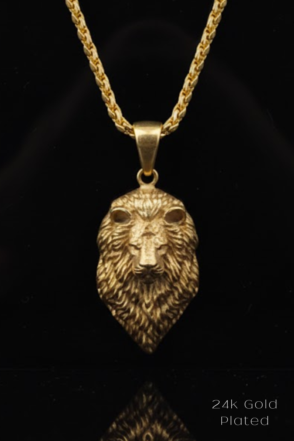 A 24k gold-plated pendant featuring a detailed lion's head design.