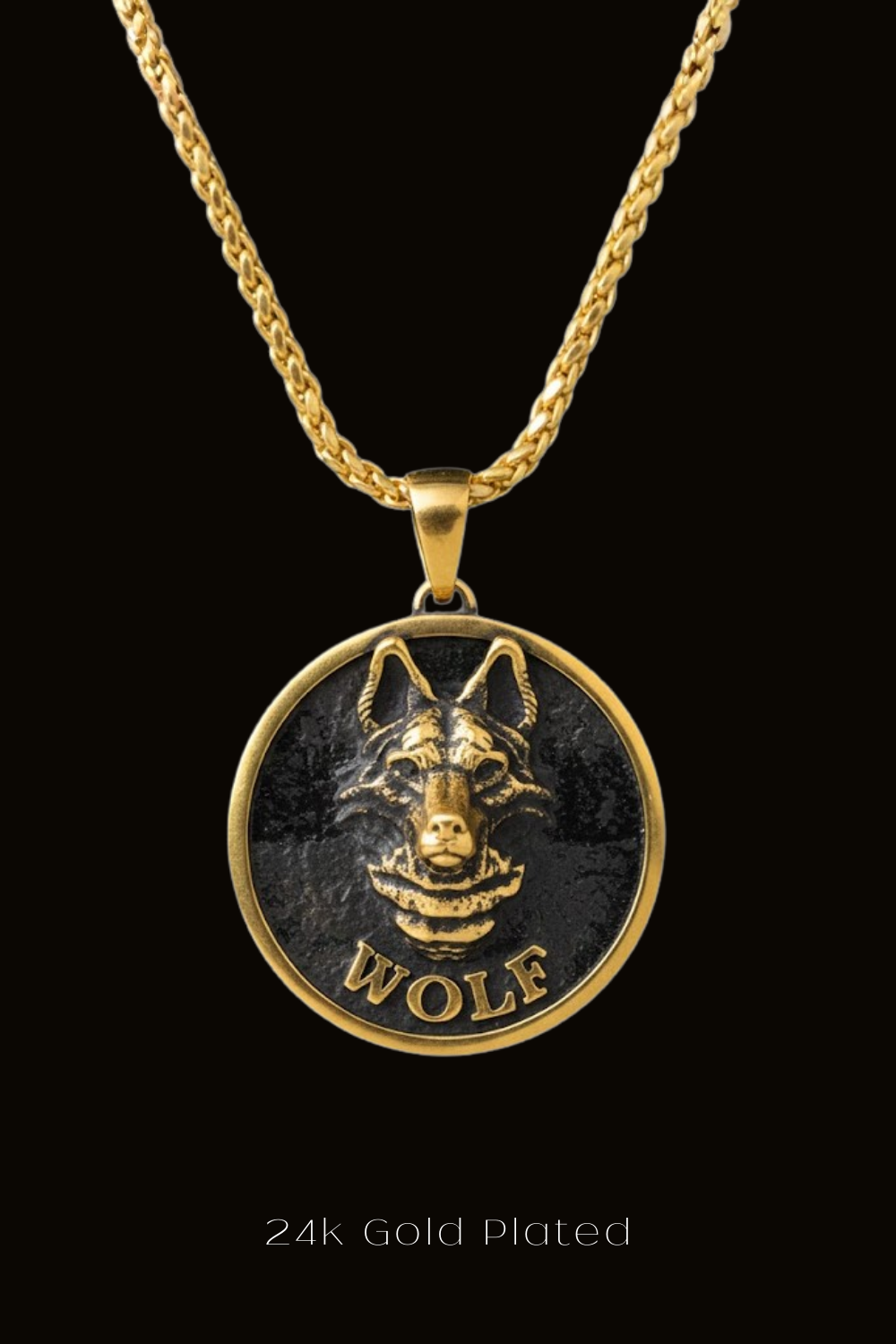 A gold-plated pendant featuring a detailed engraved image of a wolf's head.