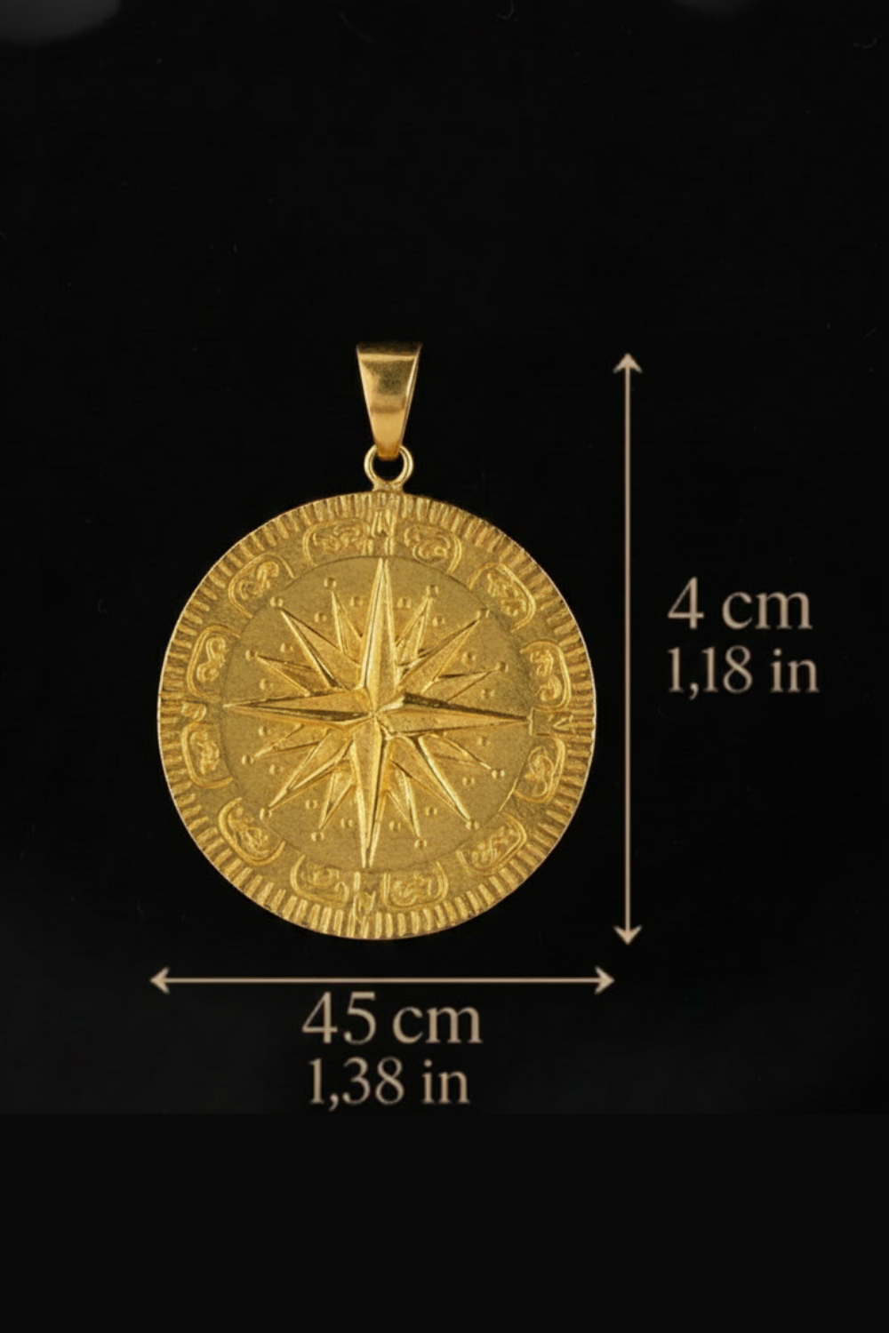 a large gold compass pendant with a detailed design.