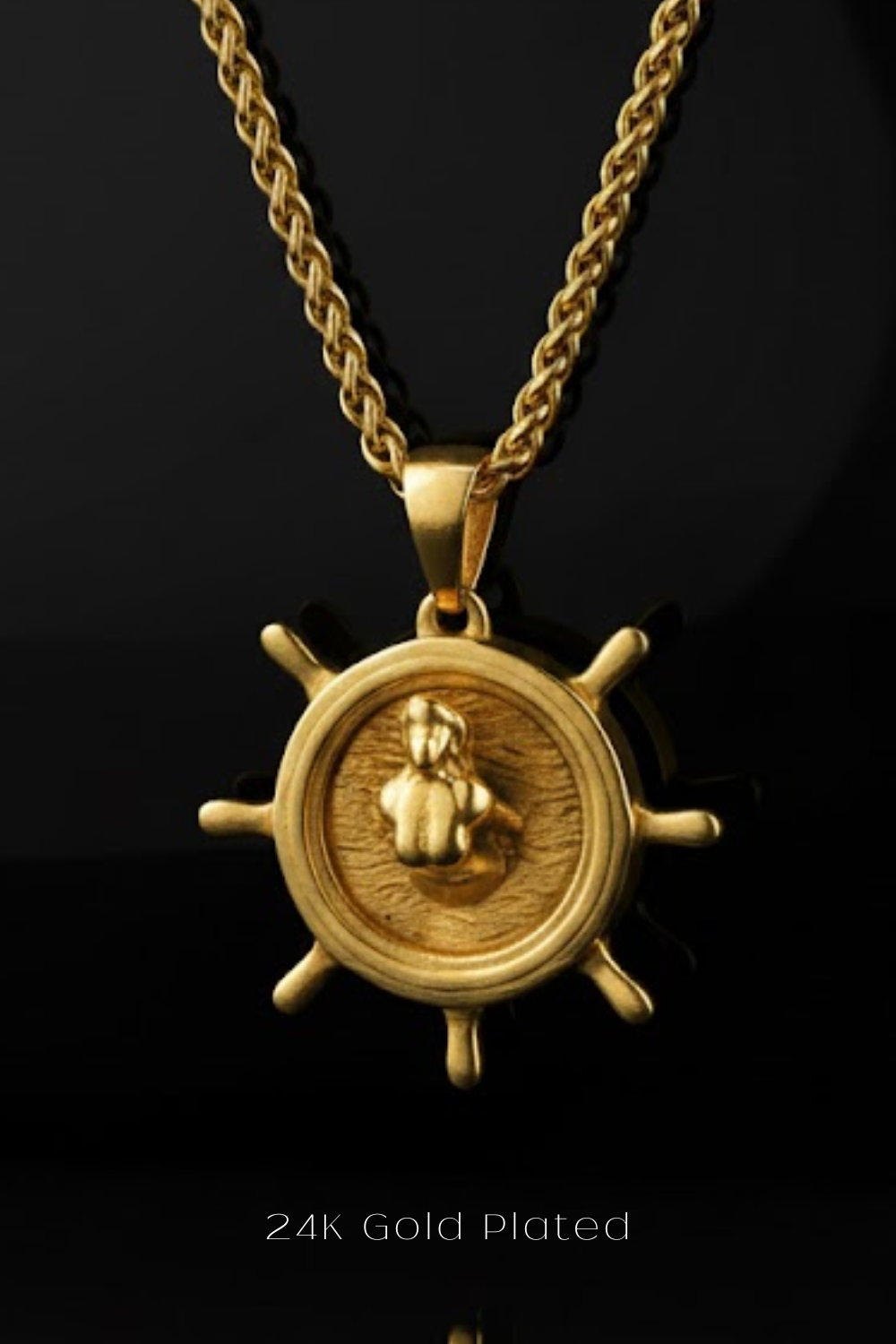 A 24K gold-plated pendant featuring a ship's wheel design.