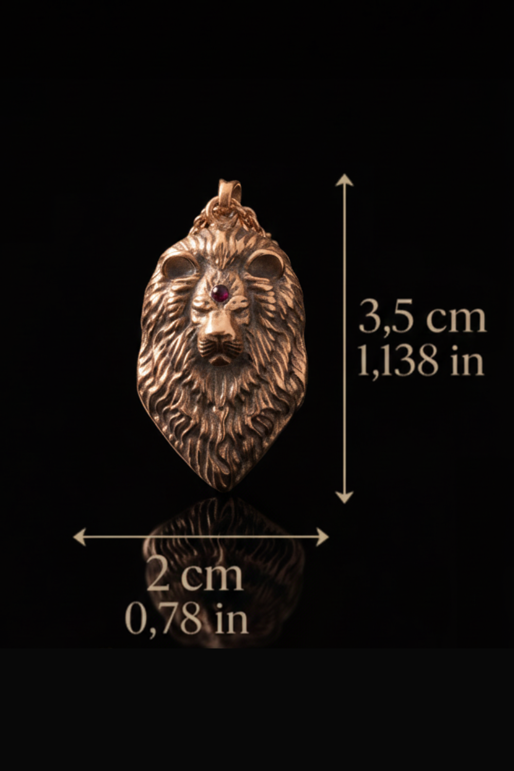 A close-up image of a gold-colored lion pendant with a red gemstone, against a black background.