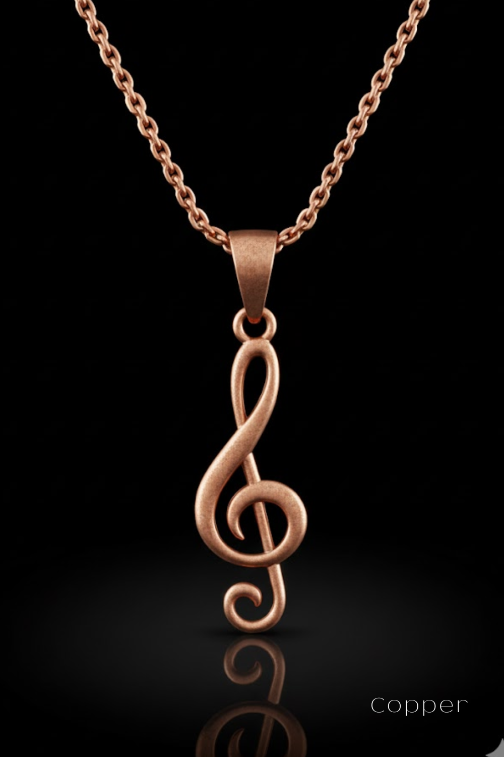 A copper-colored musical note pendant with a chain is displayed against a black background.