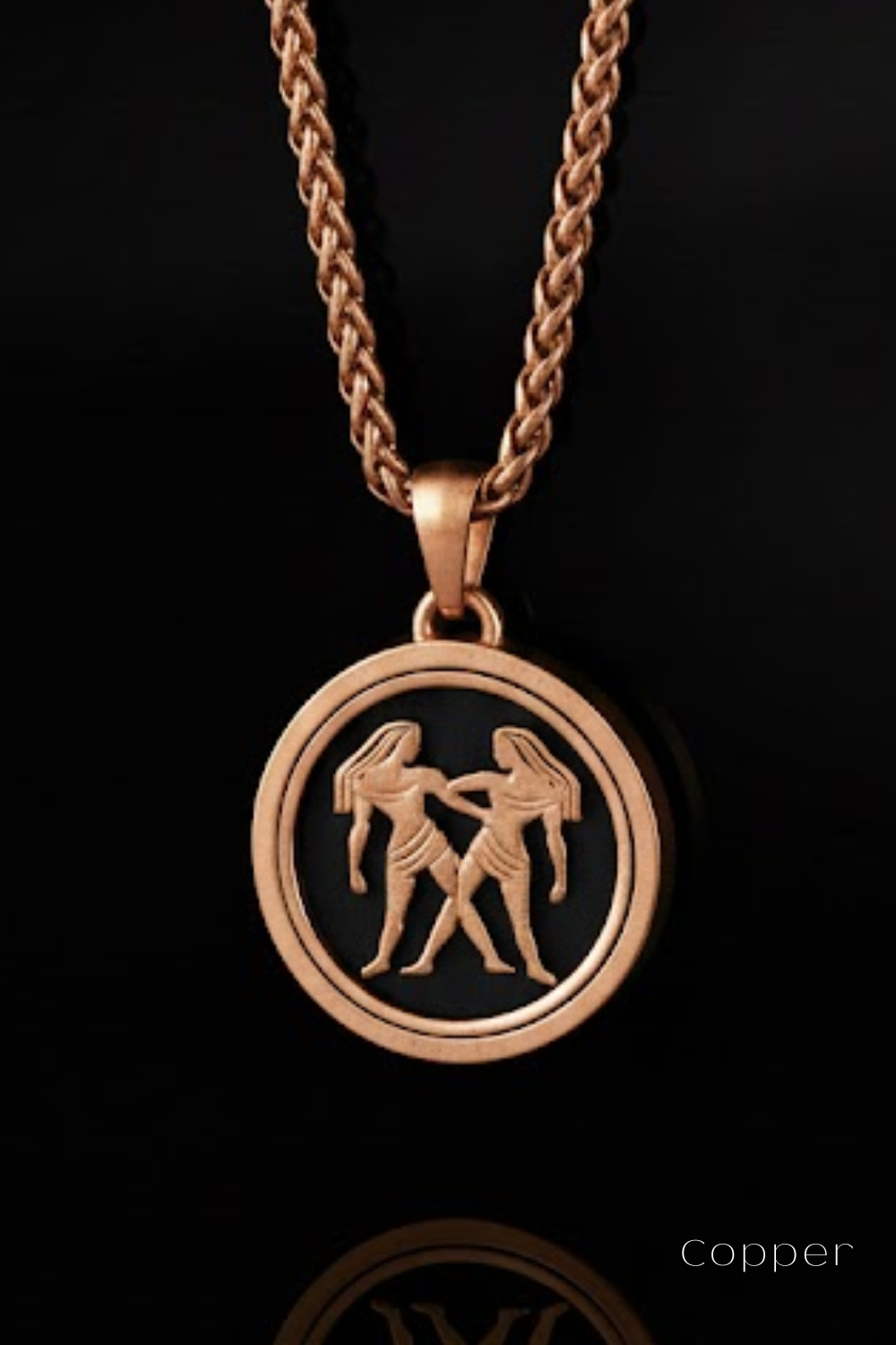 A copper-colored pendant necklace with a circular pendant featuring a design of two women holding hands.