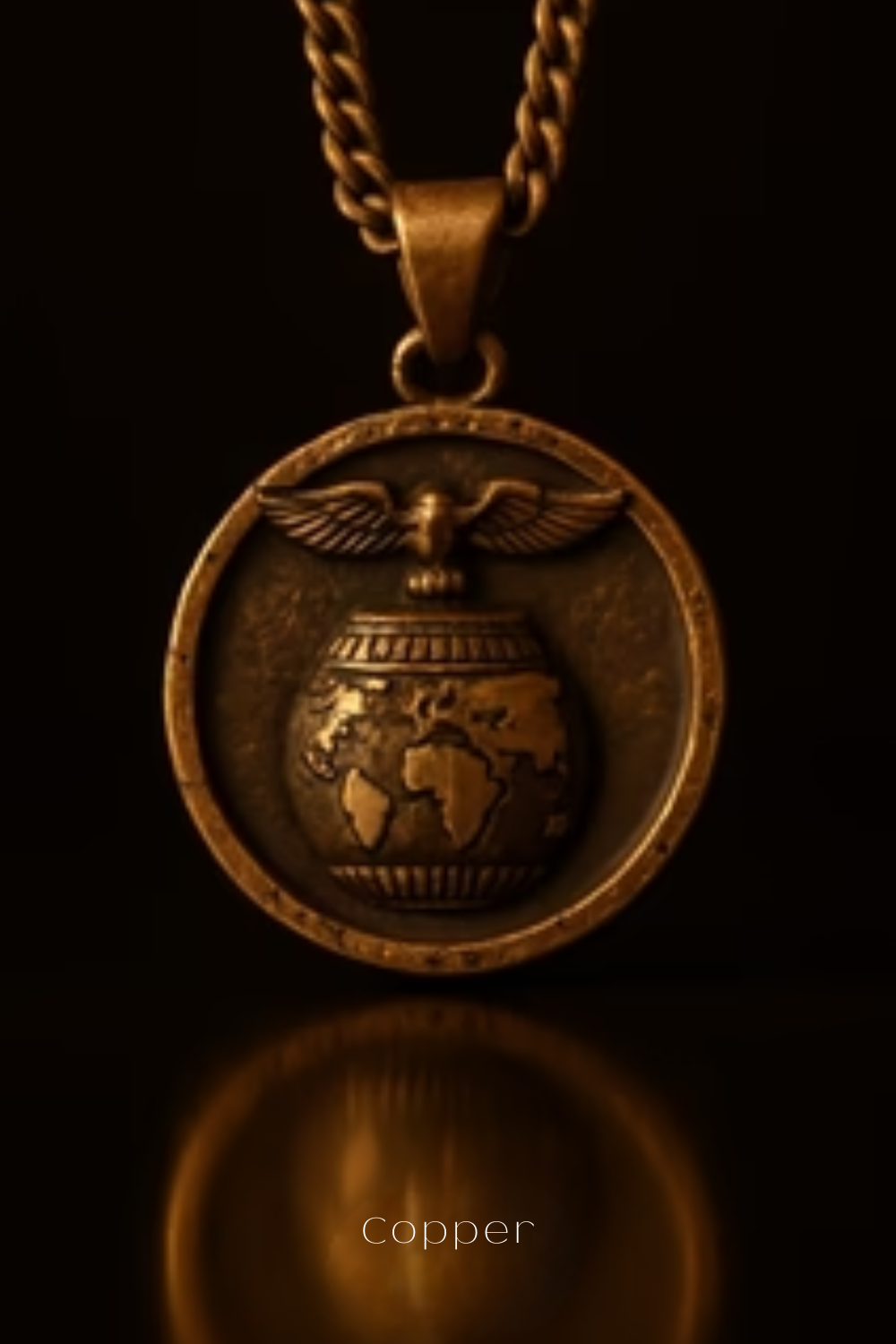 A gold-colored pendant necklace with a circular medallion featuring a globe and wings design.