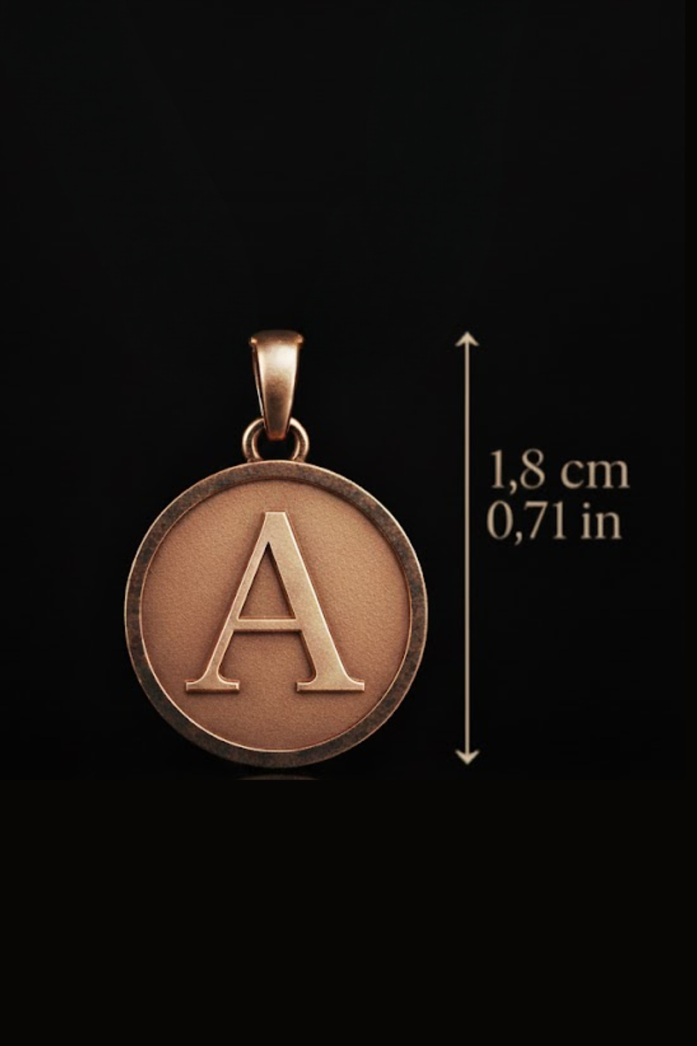A close-up image of a round pendant with a letter "A" on it, against a black background.