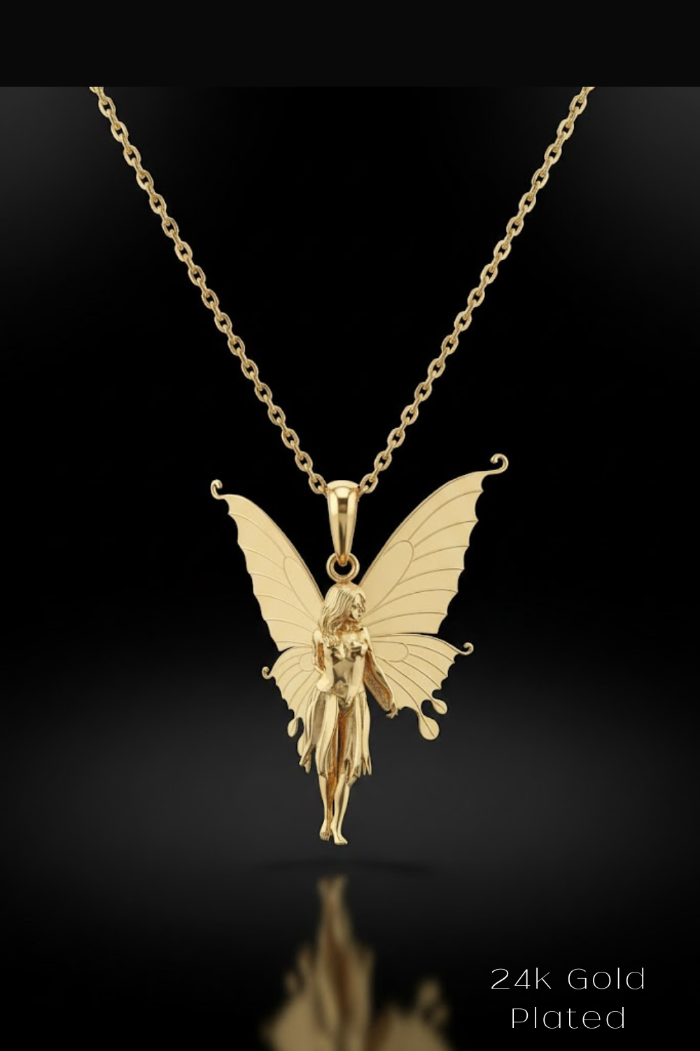 A gold-colored pendant featuring a fairy-like figure with butterfly wings, suspended from a chain against a black background.