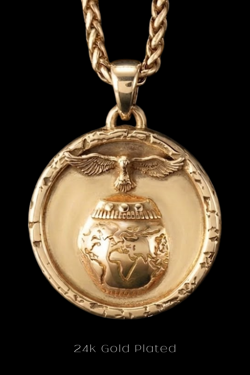 A 24k gold plated pendant featuring a detailed design of a globe with wings and an eagle.