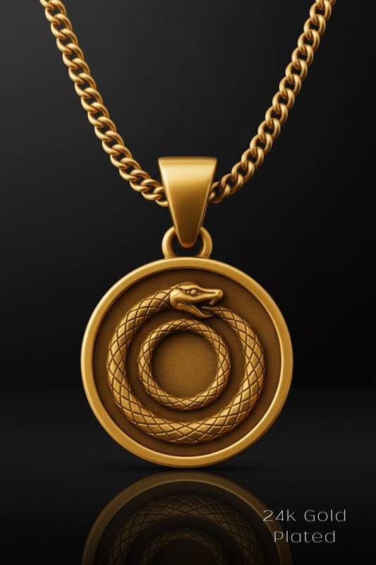 A gold-colored pendant necklace with a circular medallion featuring a snake design.