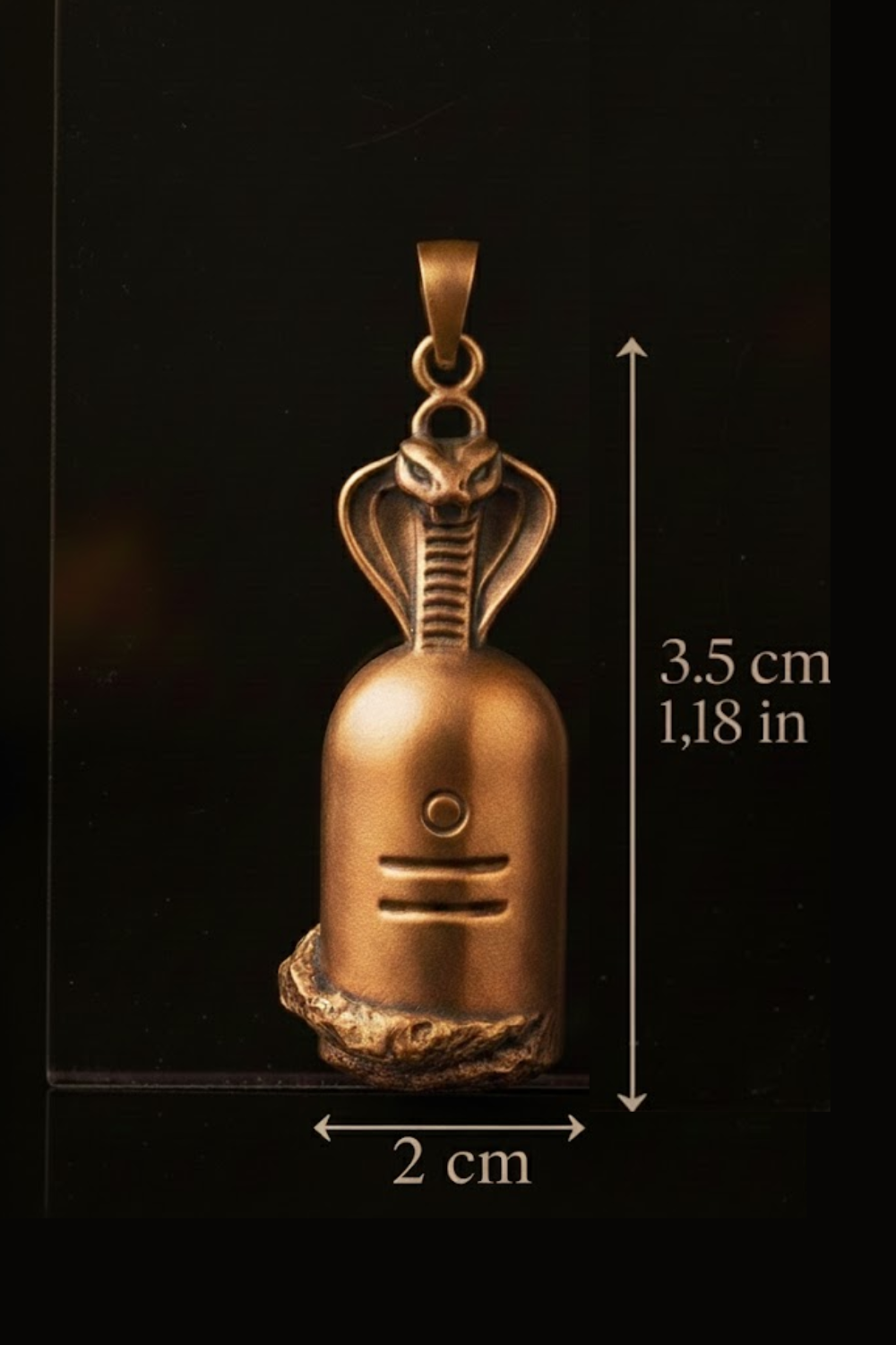 A golden pendant in the shape of a snake, with a small circular symbol at the center, is shown against a black background.