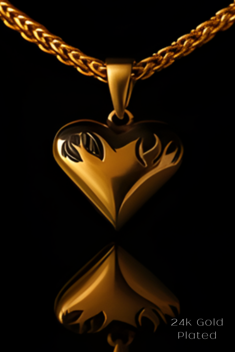 A 24k gold plated heart-shaped pendant with a chain is displayed against a black background.