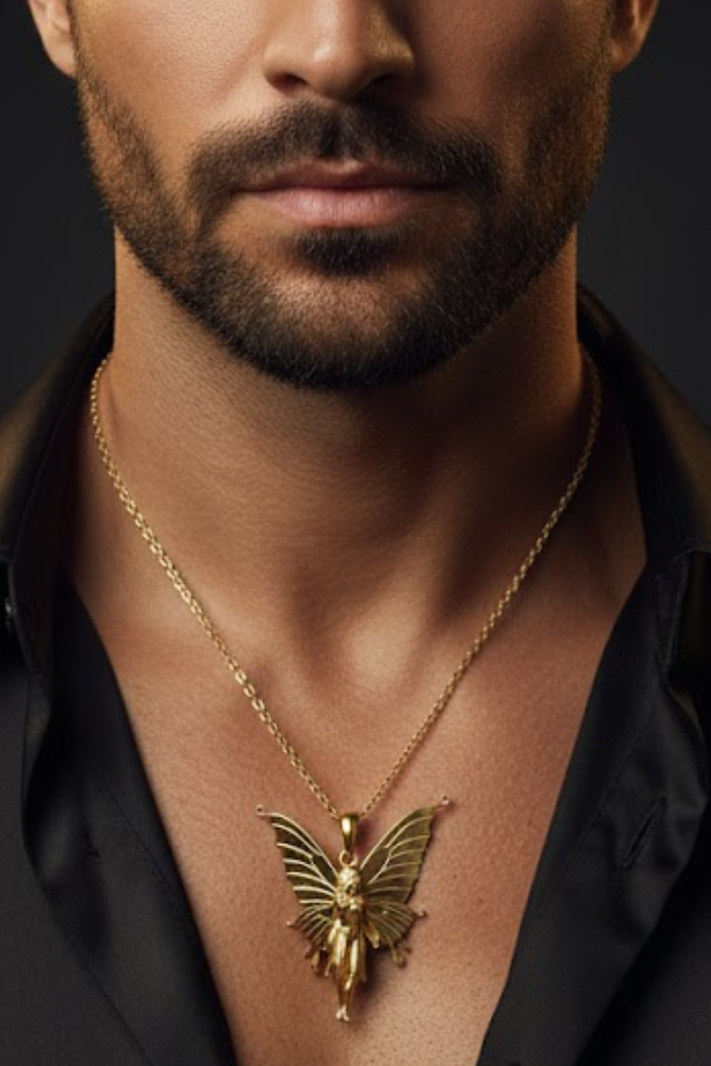 A close-up of a man's neck and chest area, with a gold butterfly pendant necklace visible.