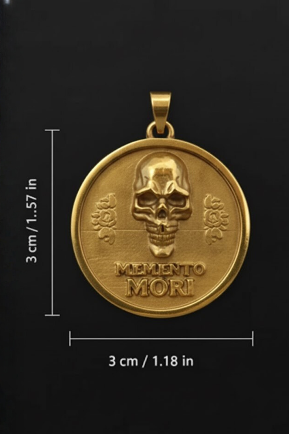 a gold-colored pendant with a skull design and the Latin phrase "Memento mori" (which means "Remembering the dead" in English). The pendant is shown against a black background, and there are measurements provided in centimeters and inches.