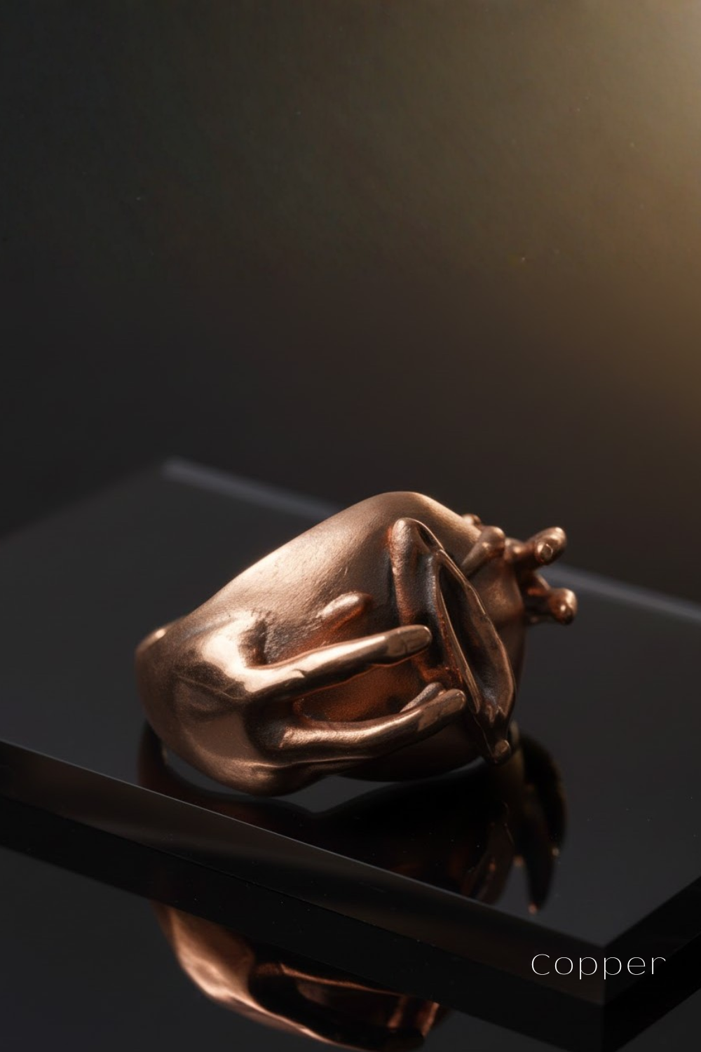 a shiny, metallic ring with a unique, abstract design.