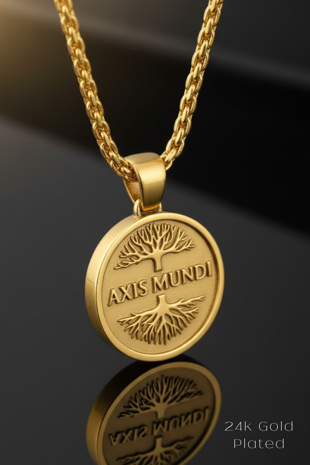 A gold-colored pendant necklace with a circular medallion featuring the text "AXIS MUNDI" and a tree design.