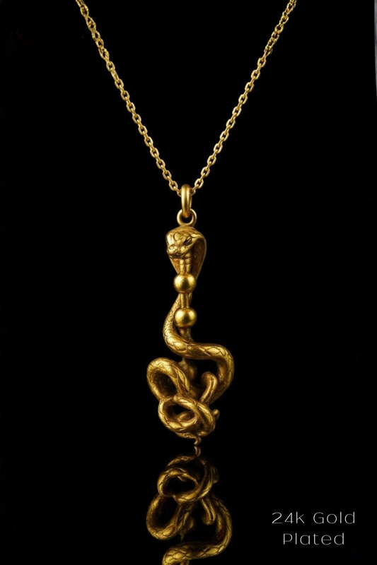 A gold-plated pendant necklace with a snake design on a chain.