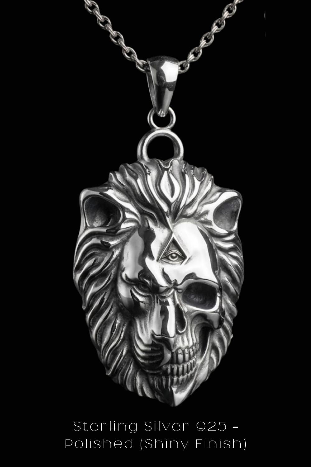 A silver pendant in the shape of a lion's head with a skull-like design, suspended from a chain.