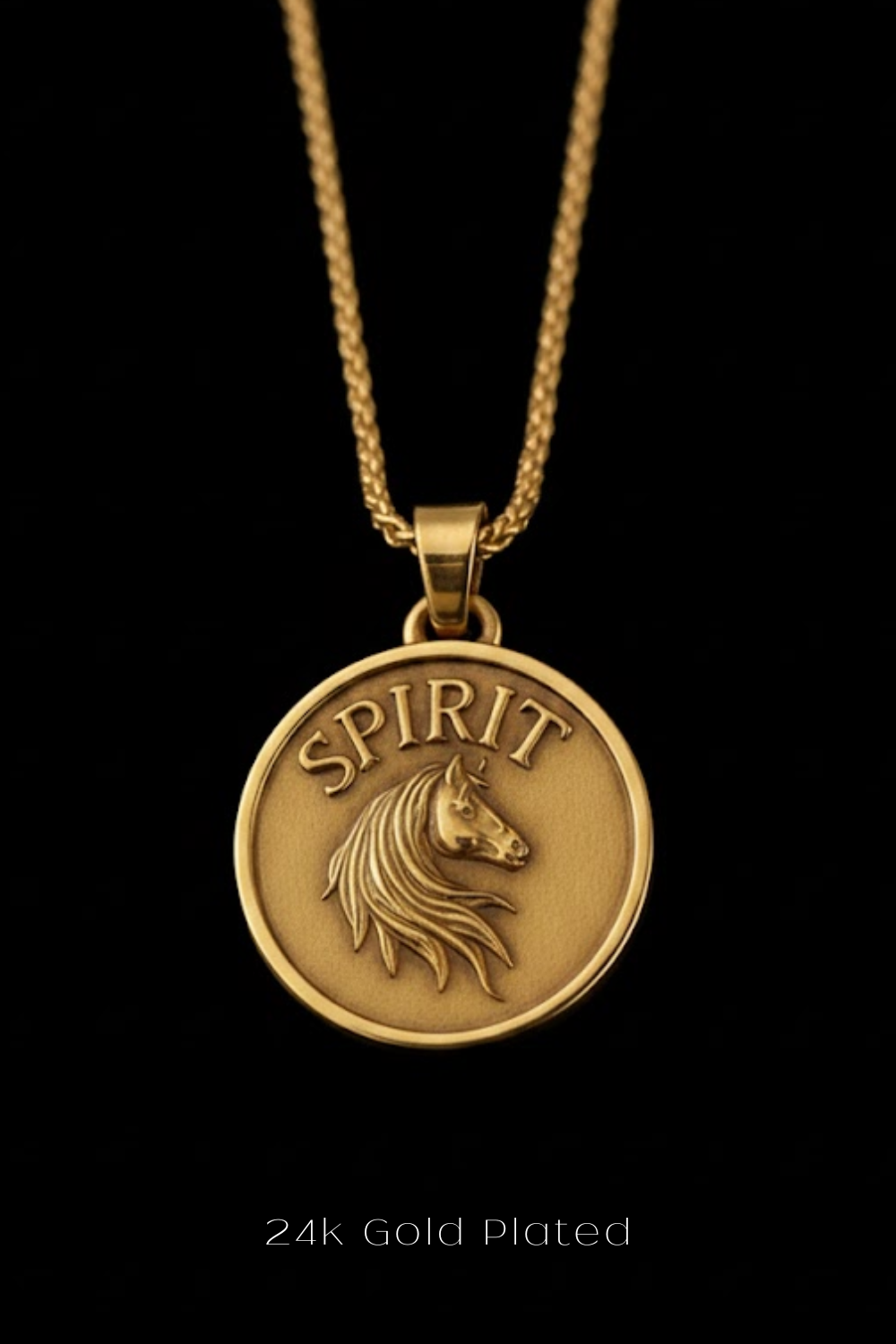 A gold-plated pendant necklace with a circular medallion featuring a horse's head and the word "SPIRIT" engraved on it.