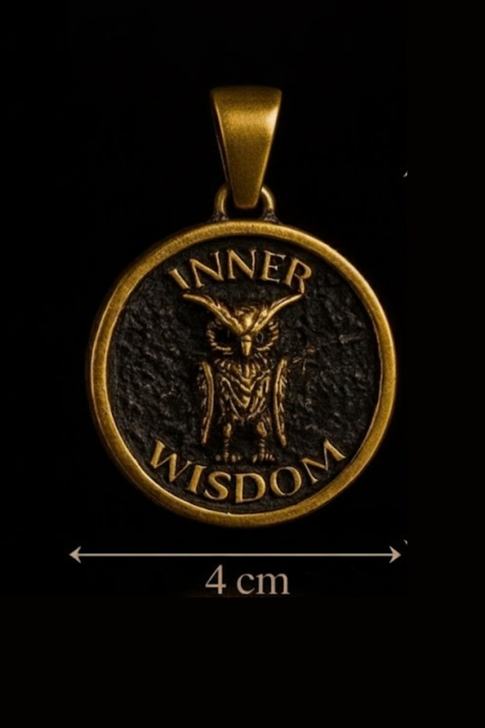A gold-colored pendant with an owl design and the text "INNER WISDOM" inside a circular frame.