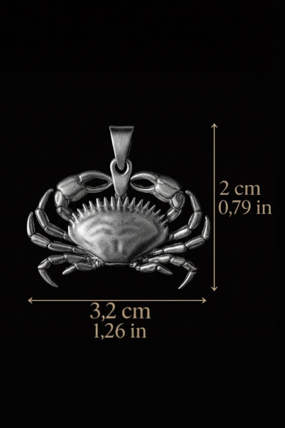 a silver crab pendant with measurements provided.