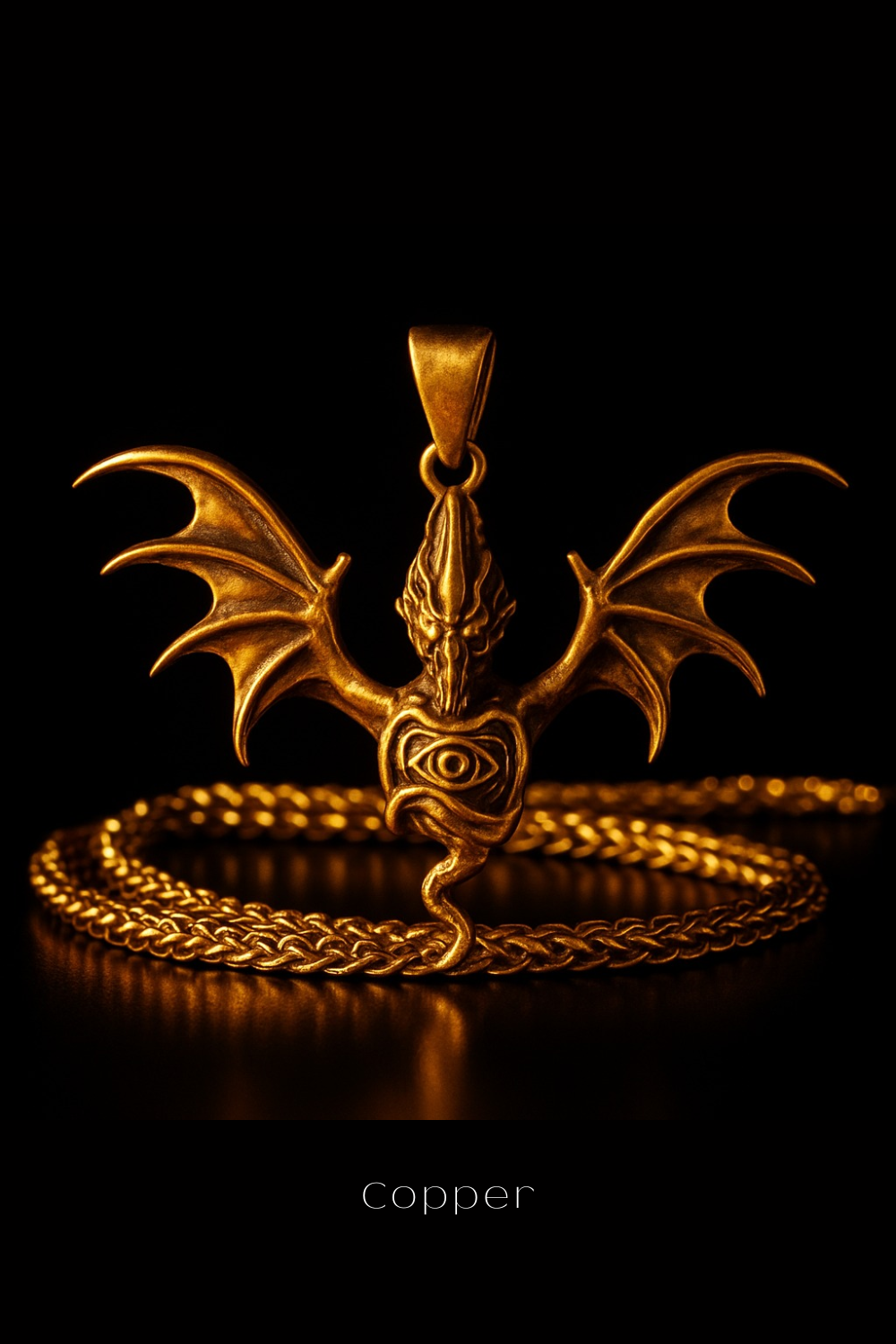 A golden pendant in the shape of a winged creature with an eye in the center, surrounded by a chain.