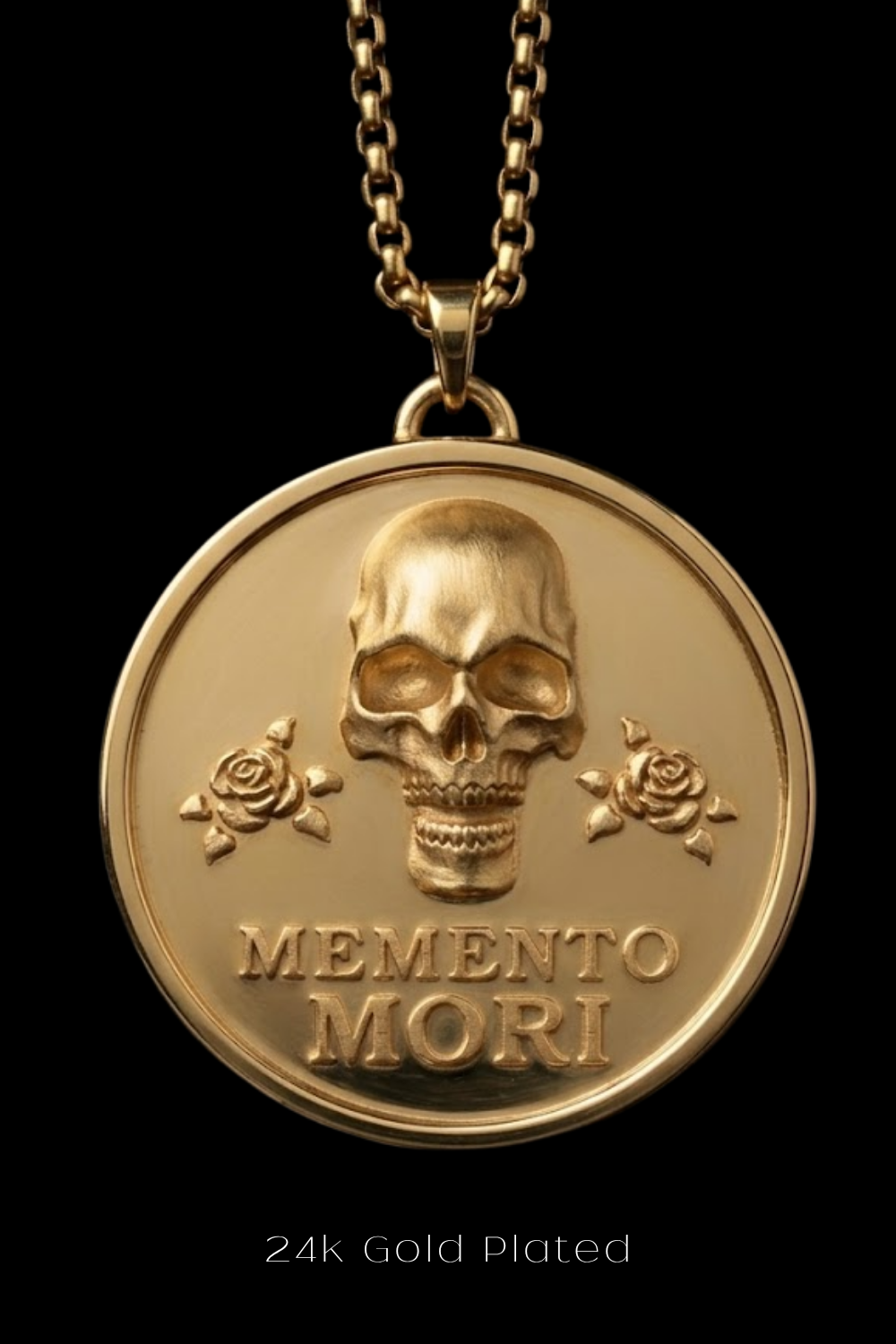 A 24k gold plated pendant featuring a skull with roses and the Latin phrase "Memento mori" (which means "Remembering the dead" in English).